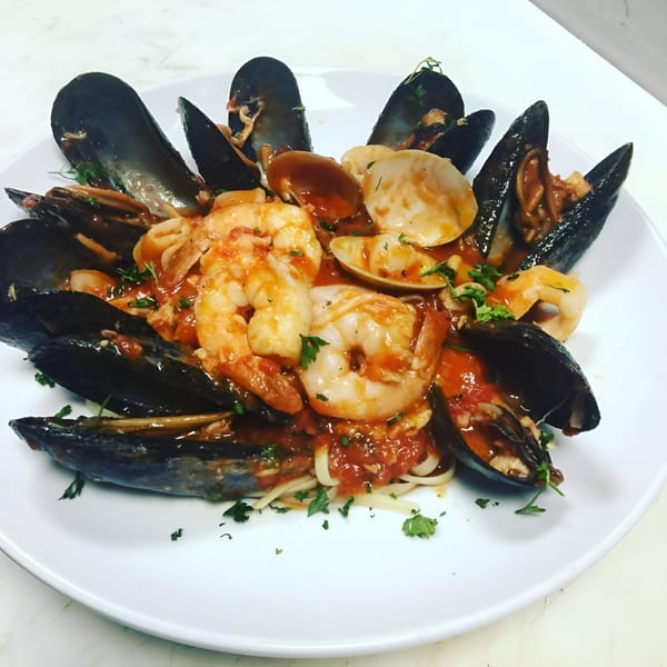 Mike's Pizzeria & Italian Restaurant's linguine with mussels, clams, and shrimp in red sauce.