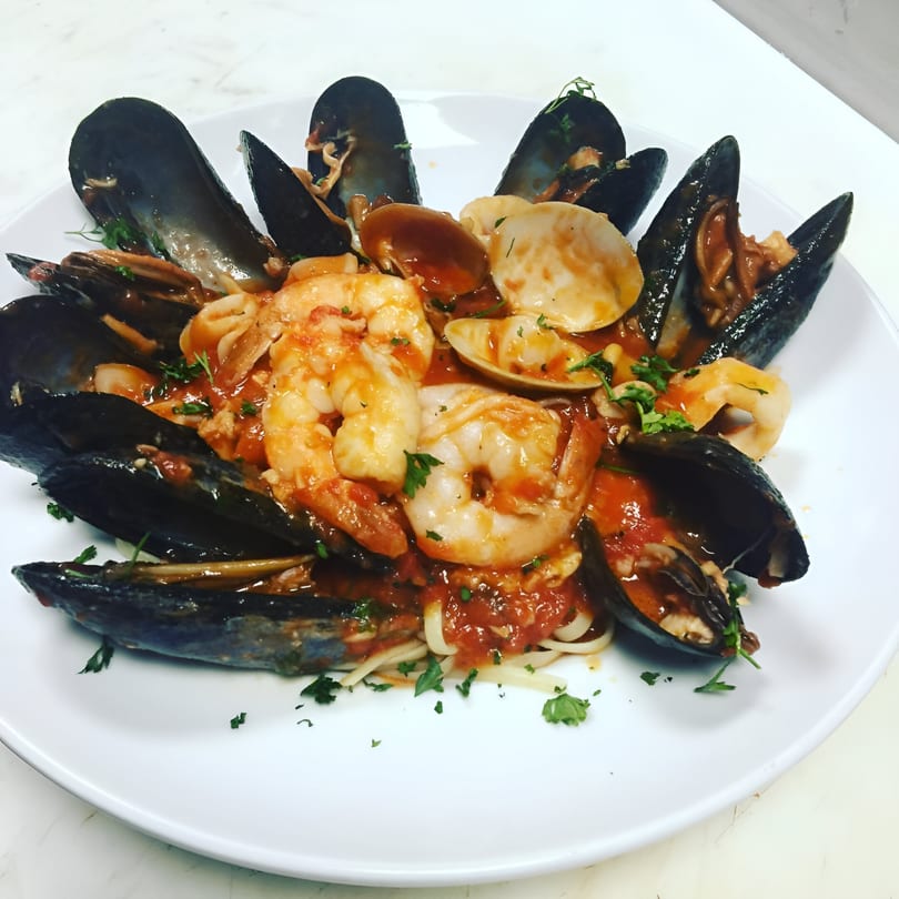 Mike's Pizzeria & Italian Restaurant's linguine with mussels, clams, and shrimp in red sauce.